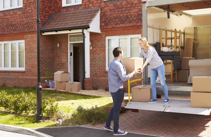 couple just sold their house and are packing to move