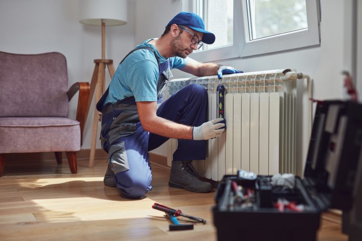 Man fixing a radiator 