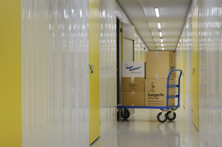 boxes on trolley in self storage unit