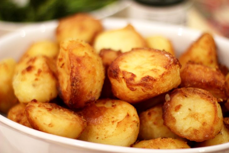 Roast potatoes in a dish