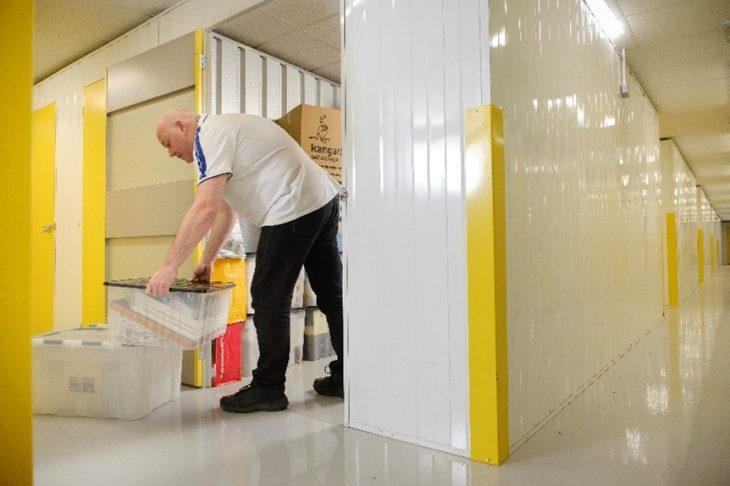 Kangaroo Self-Storage staff member packing a storage unit