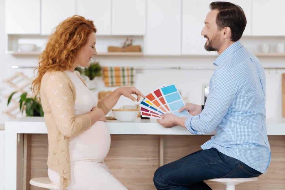 couple picking out colours for a nursery