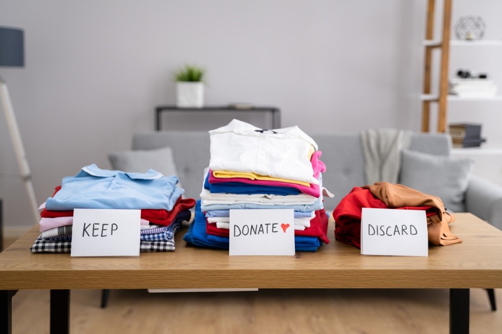 keep, donate, and discard piles of clothes