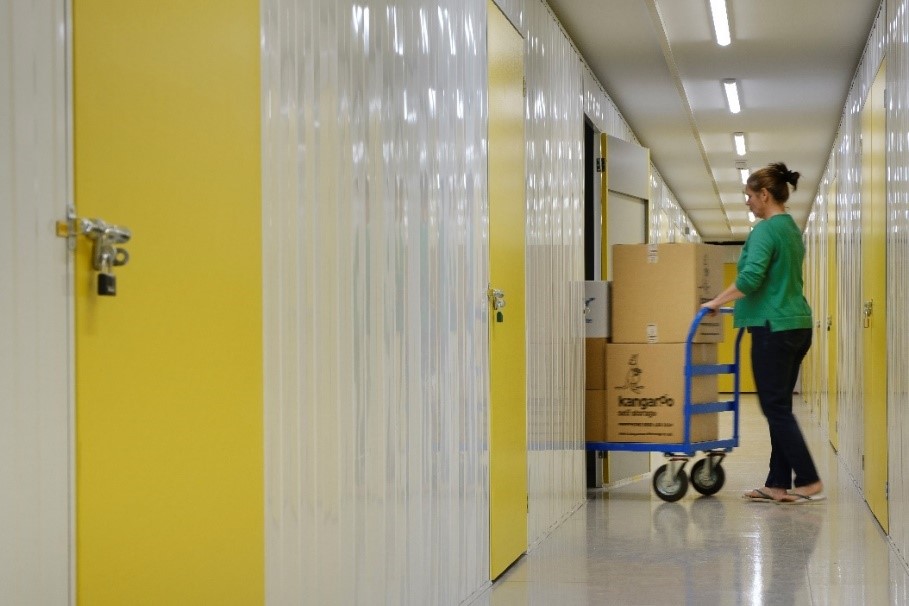 wheeling boxes into a self storage unit