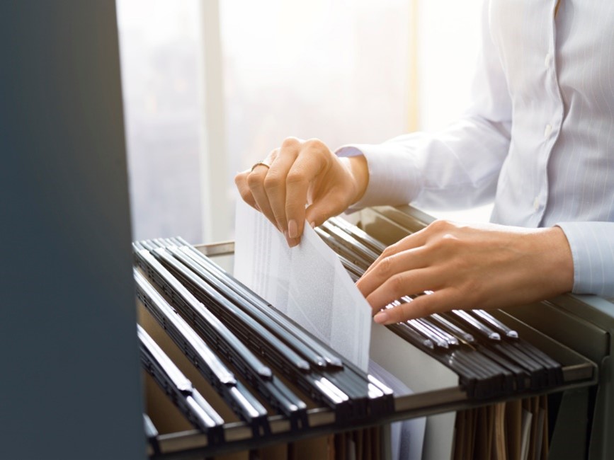 filing documents in a filing cabinet